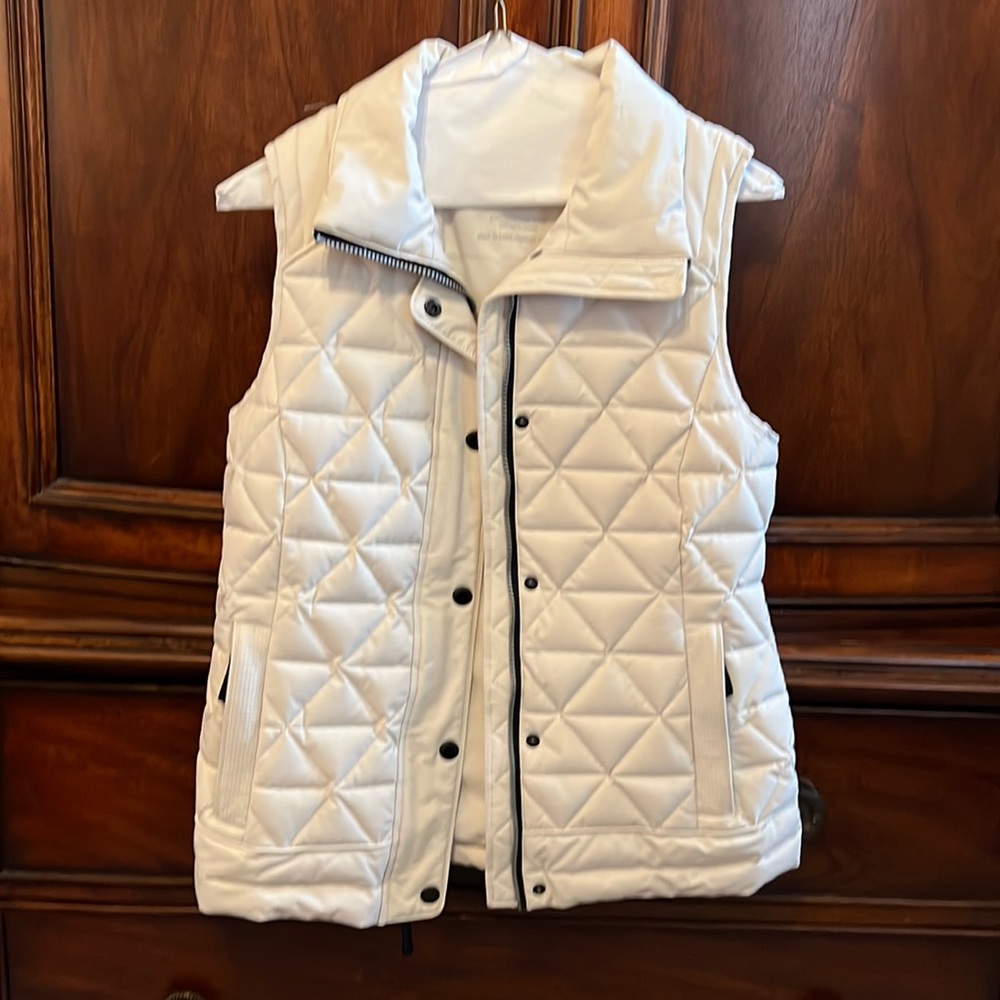 Cream colored puffy vest, very good condition.